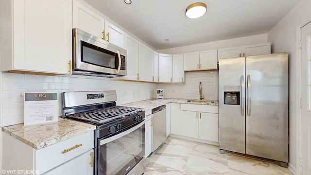 22201 Windsor Ct, Richton Park, IL 60471 - kitchen featuring stainless steel appliances, light marble finish flooring, light stone counters, decorative backsplash, and white cabinetry