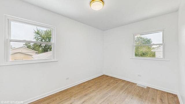 22201 Windsor Ct, Richton Park, IL 60471 - spare room featuring baseboards and light wood-style floors