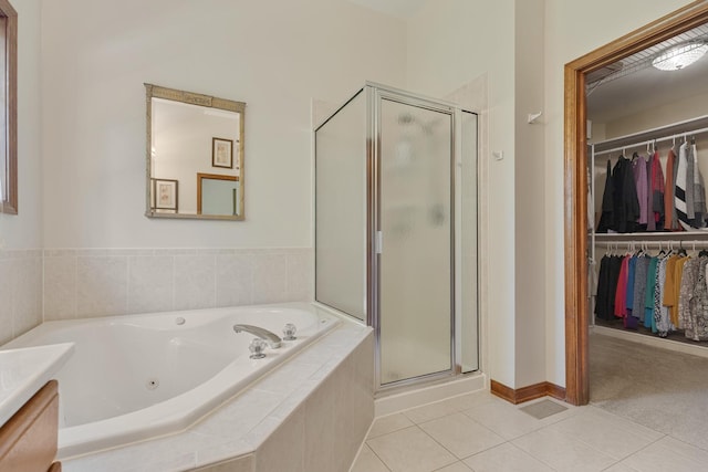 2251 Sutton Dr, South Elgin, IL 60177 - bathroom featuring a stall shower, a whirlpool tub, a spacious closet, and tile patterned flooring