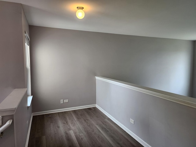 3169 Pearl St, Elgin, IL 60124 - empty room featuring dark wood-style floors and baseboards