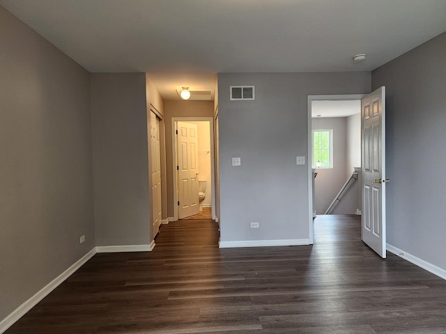 3169 Pearl St, Elgin, IL 60124 - empty room featuring a smoke detector and dark wood-style flooring
