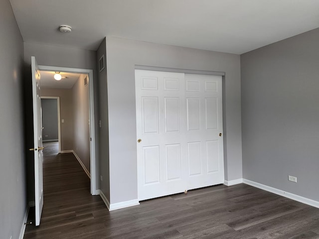 3169 Pearl St, Elgin, IL 60124 - unfurnished bedroom featuring dark wood finished floors and a closet