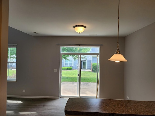 3169 Pearl St, Elgin, IL 60124 - dining space featuring plenty of natural light and dark wood-type flooring