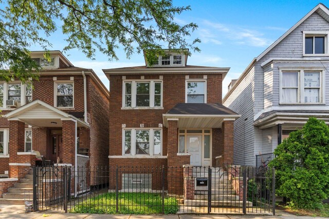 2507 W 45th Pl, Chicago, IL 60632 - american foursquare style home featuring a fenced front yard, a gate, and brick siding