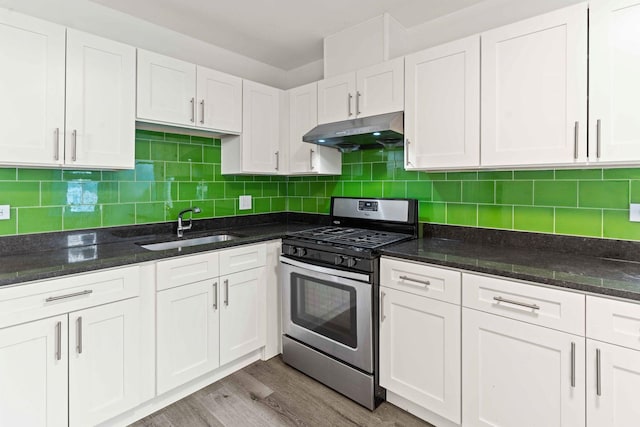 2507 W 45th Pl, Chicago, IL 60632 - kitchen with stainless steel gas range oven, under cabinet range hood, and white cabinets