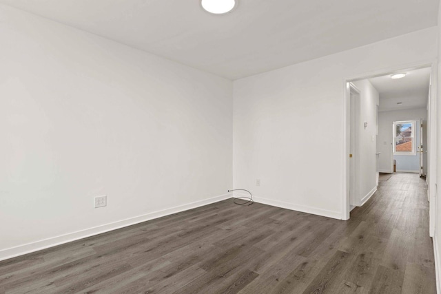 2507 W 45th Pl, Chicago, IL 60632 - empty room with dark wood-style flooring and baseboards