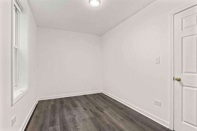 2507 W 45th Pl, Chicago, IL 60632 - spare room featuring dark wood-style floors and baseboards