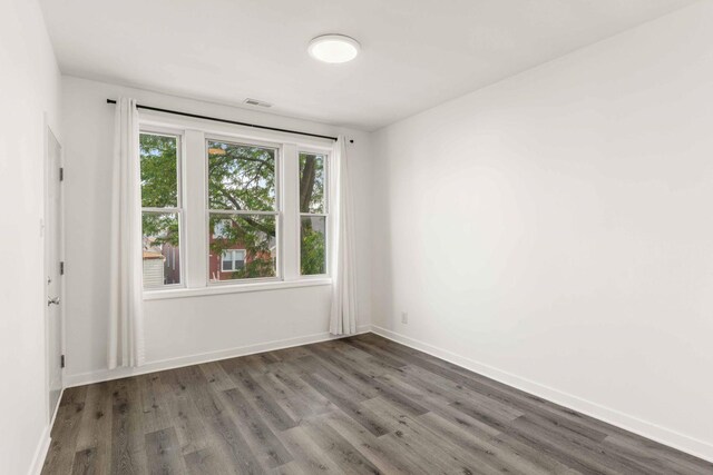 2507 W 45th Pl, Chicago, IL 60632 - unfurnished room with wood finished floors and baseboards