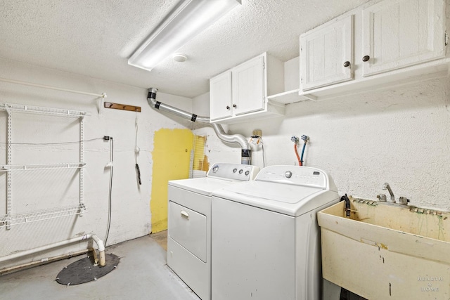 294 Apache Trl, Lake In The Hills, IL 60156 - washroom with cabinet space, washer and dryer, and a textured ceiling