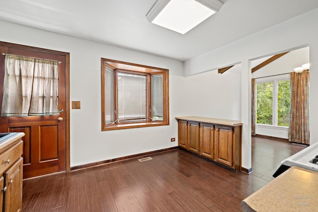 294 Apache Trl, Lake In The Hills, IL 60156 - unfurnished dining area with dark wood-type flooring and baseboards