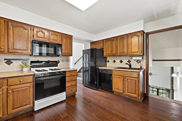 294 Apache Trl, Lake In The Hills, IL 60156 - kitchen with black appliances, dark wood-style floors, tasteful backsplash, and brown cabinets