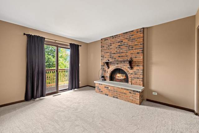 294 Apache Trl, Lake In The Hills, IL 60156 - unfurnished living room featuring carpet flooring and a brick fireplace