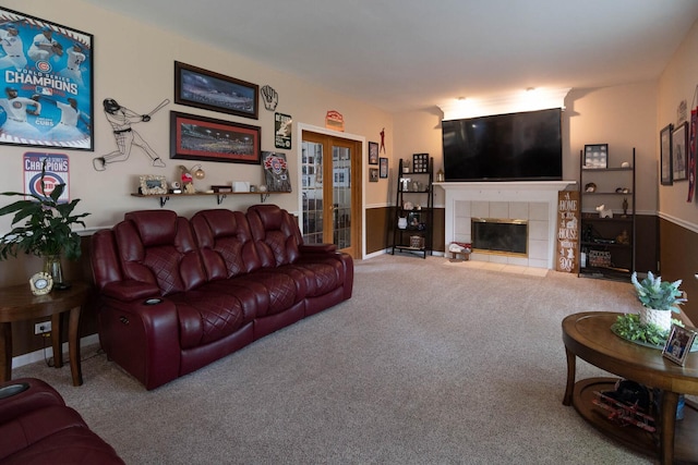 85 Fieldstone Dr, Lake Villa, IL 60046 - carpeted living room featuring a tile fireplace and french doors