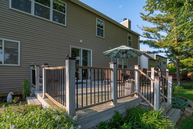 85 Fieldstone Dr, Lake Villa, IL 60046 - rear view of house with a chimney and a wooden deck