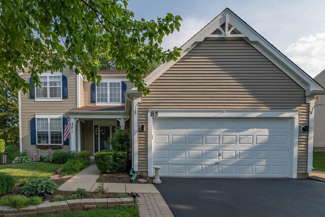 85 Fieldstone Dr, Lake Villa, IL 60046 - view of front of home featuring asphalt driveway and a garage