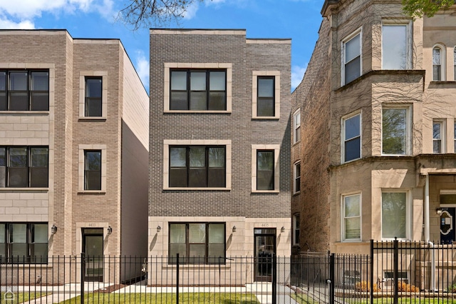 4435 S Prairie Ave, Chicago, IL 60653 - view of front of house featuring a fenced front yard and brick siding