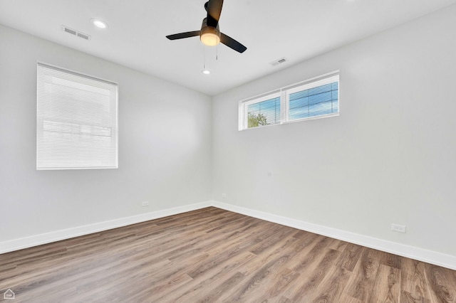 4435 S Prairie Ave, Chicago, IL 60653 - empty room featuring wood finished floors, a ceiling fan, and recessed lighting