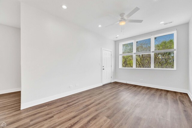 4435 S Prairie Ave, Chicago, IL 60653 - unfurnished room with wood finished floors, ceiling fan, and recessed lighting