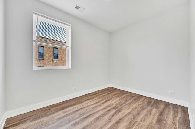 4435 S Prairie Ave, Chicago, IL 60653 - unfurnished room with wood finished floors and baseboards