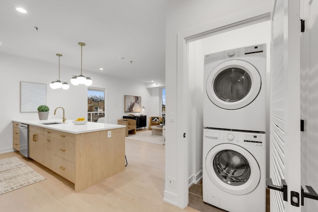 3204 N Kostner Ave Unit 301, Chicago, IL 60641 - laundry area with stacked washer and clothes dryer, recessed lighting, and light wood finished floors