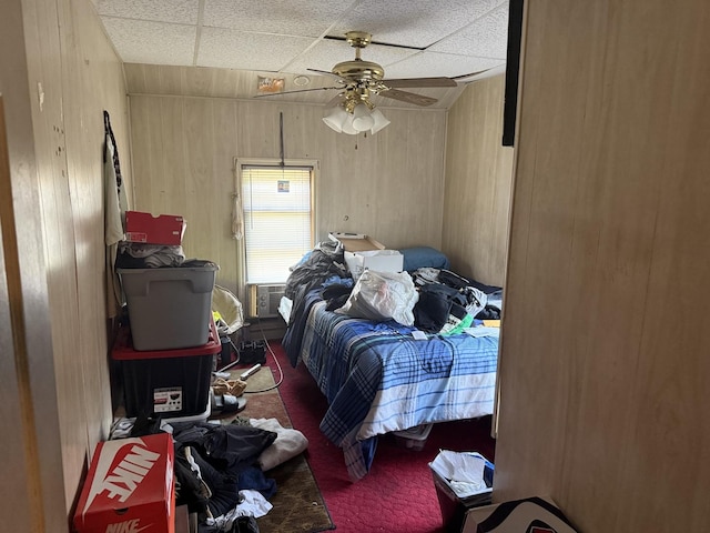 526 Gardner St, Joliet, IL 60433 - carpeted bedroom featuring a drop ceiling, wooden walls, and a ceiling fan