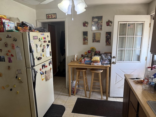526 Gardner St, Joliet, IL 60433 - kitchen with freestanding refrigerator and ceiling fan