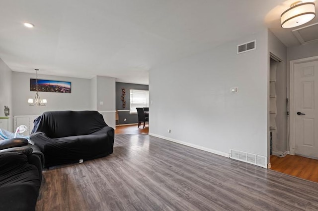 1311 Juneway Ter, Round Lake Beach, IL 60073 - living room featuring wood finished floors and a chandelier