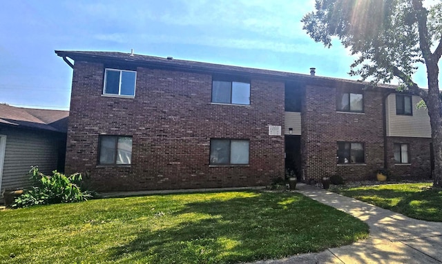 1303 Christopher Cir Unit 8, Urbana, IL 61802 - view of front facade with a front lawn and brick siding