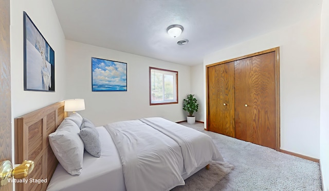 1303 Christopher Cir Unit 8, Urbana, IL 61802 - carpeted bedroom featuring a closet and baseboards