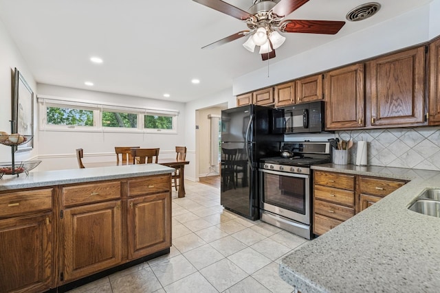 1355 S Highland Ave, Arlington Heights, IL 60005 - kitchen with black appliances, ceiling fan, tasteful backsplash, light tile patterned floors, and brown cabinetry