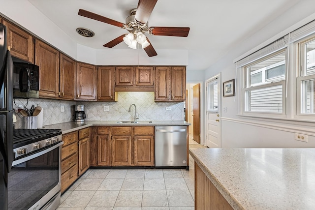1355 S Highland Ave, Arlington Heights, IL 60005 - kitchen featuring black appliances, a ceiling fan, decorative backsplash, brown cabinets, and light tile patterned floors