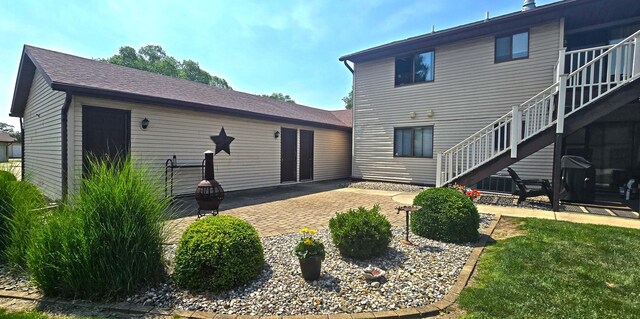 1301 Clifford Ave Unit 8, Urbana, IL 61802 - rear view of property featuring a patio area and stairway