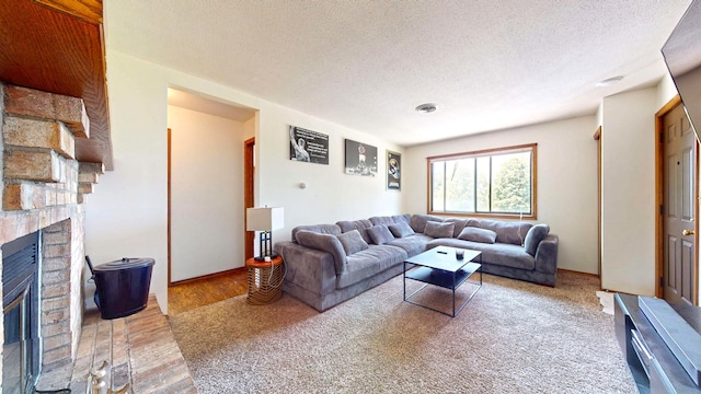 1301 Clifford Ave Unit 8, Urbana, IL 61802 - living area with a fireplace, wood finished floors, and a textured ceiling