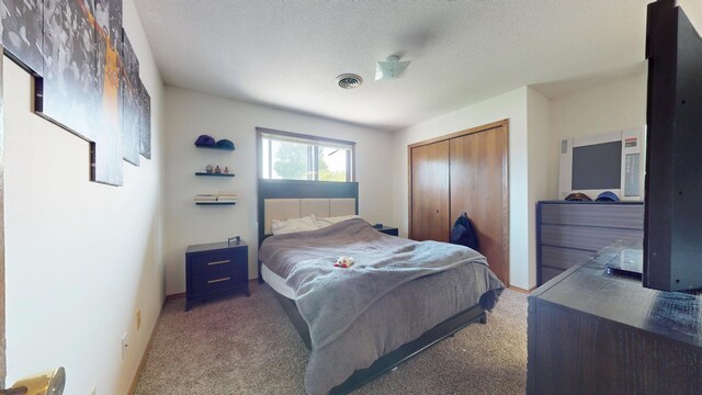 1301 Clifford Ave Unit 8, Urbana, IL 61802 - carpeted bedroom with a closet and a textured ceiling