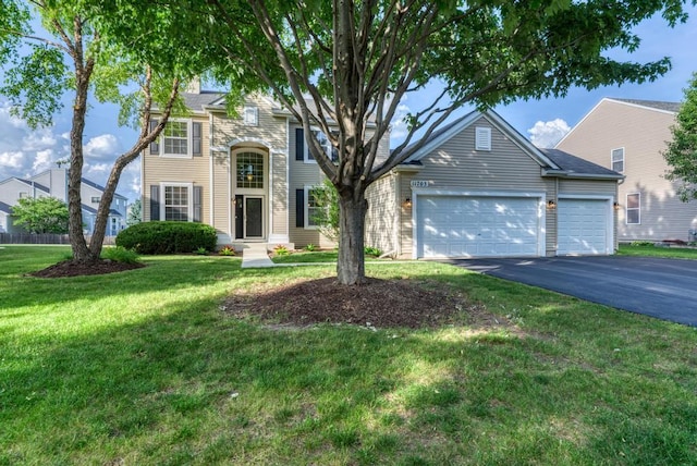 11703 Wolf Creek Ln, Plainfield, IL 60585 - traditional home with driveway, a garage, and a front lawn