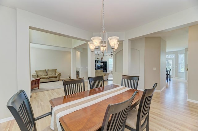 11703 Wolf Creek Ln, Plainfield, IL 60585 - dining space with light wood-style floors and a chandelier