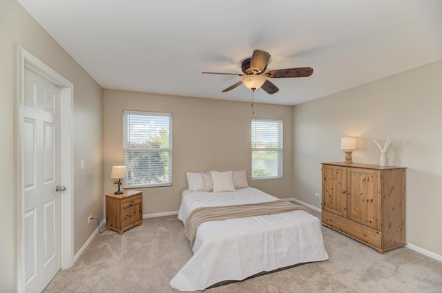 11703 Wolf Creek Ln, Plainfield, IL 60585 - bedroom with multiple windows, light colored carpet, and ceiling fan