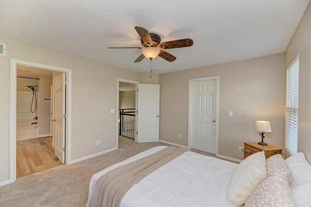 11703 Wolf Creek Ln, Plainfield, IL 60585 - carpeted bedroom with a ceiling fan and ensuite bath