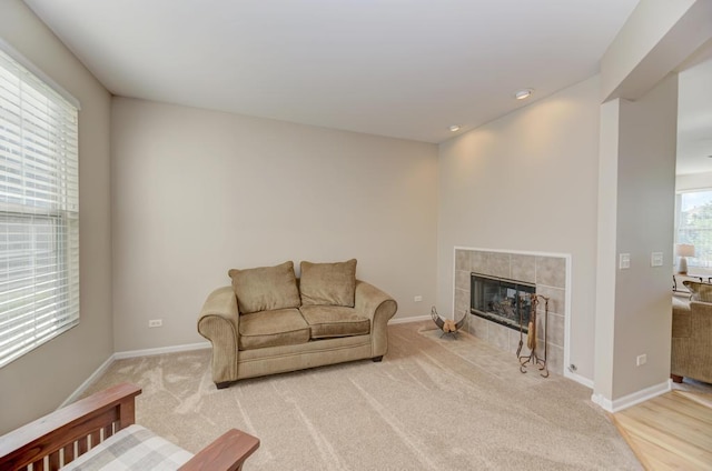 11703 Wolf Creek Ln, Plainfield, IL 60585 - living room with light carpet, a tiled fireplace, and recessed lighting