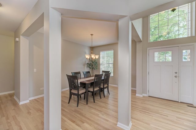 11703 Wolf Creek Ln, Plainfield, IL 60585 - entrance foyer featuring light wood finished floors and a chandelier