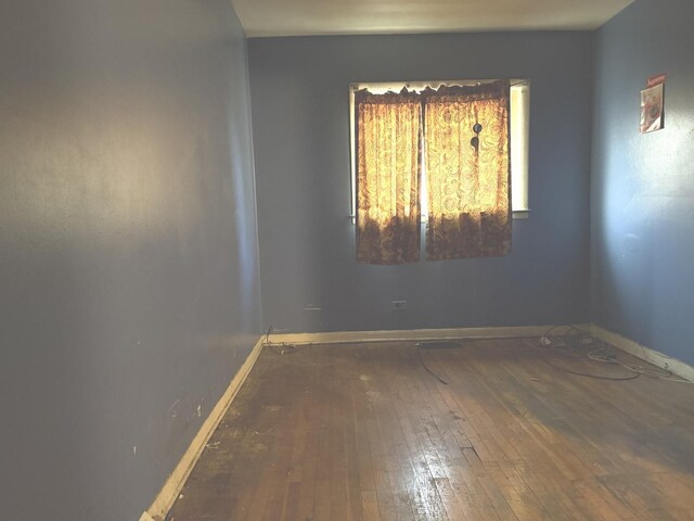 1826 S Kildare Ave, Chicago, IL 60623 - unfurnished room with hardwood / wood-style flooring and baseboards