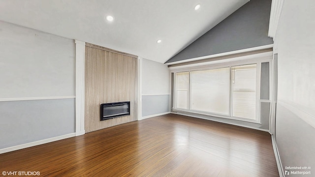 124 E 83rd St, Chicago, IL 60619 - unfurnished living room with lofted ceiling, a fireplace, heating unit, recessed lighting, and dark wood-style floors