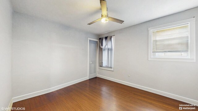 124 E 83rd St, Chicago, IL 60619 - spare room featuring dark wood finished floors and ceiling fan