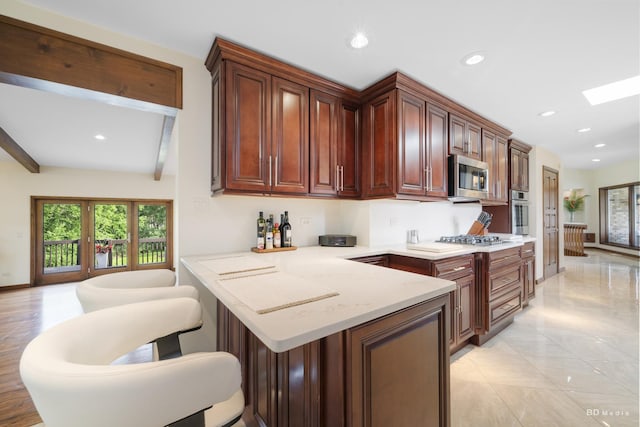 7 Bell Oak Ln, Lemont, IL 60439 - kitchen with appliances with stainless steel finishes, plenty of natural light, a peninsula, recessed lighting, and beam ceiling