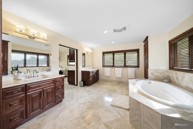 7 Bell Oak Ln, Lemont, IL 60439 - full bath with two vanities, plenty of natural light, and a tub with jets