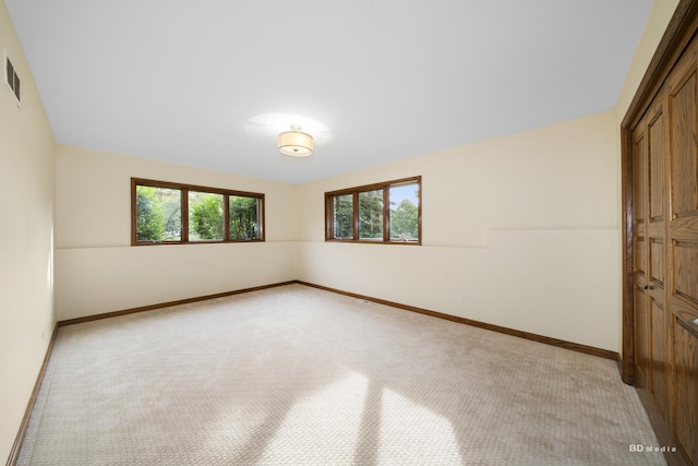 7 Bell Oak Ln, Lemont, IL 60439 - unfurnished bedroom with a closet and light colored carpet