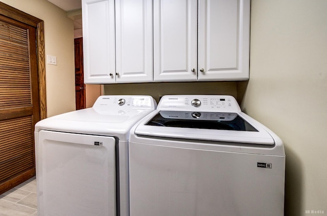 7 Bell Oak Ln, Lemont, IL 60439 - laundry room featuring washing machine and clothes dryer and cabinet space