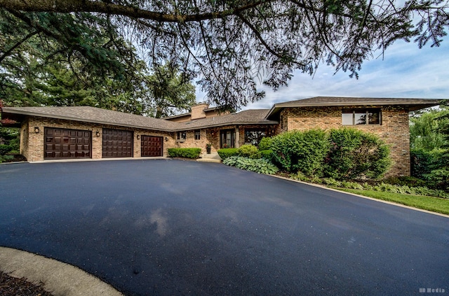 7 Bell Oak Ln, Lemont, IL 60439 - single story home with brick siding, a garage, asphalt driveway, and a chimney