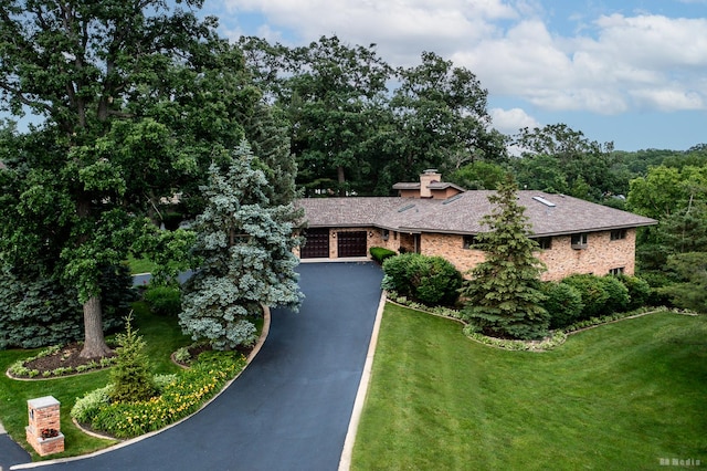 7 Bell Oak Ln, Lemont, IL 60439 - view of front of house featuring driveway, a front yard, a shingled roof, and a chimney