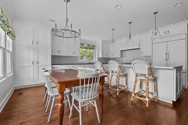 1111 Seneca Rd, Wilmette, IL 60091 - dining room featuring dark wood finished floors, recessed lighting, and ornamental molding